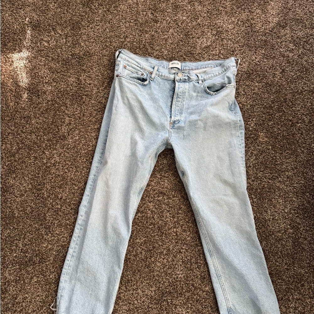 Agolde cropped light denim jeans.